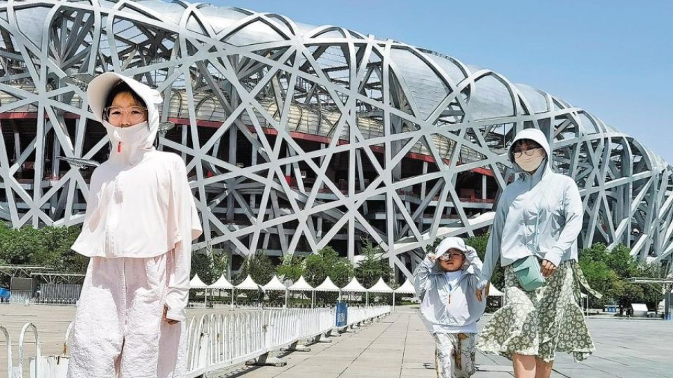 Topi Facekini Ngetren di Suhu Tinggi China Sekarang-Image-1 Topi Facekini Ngetren di Suhu Tinggi China Sekarang-Image-1